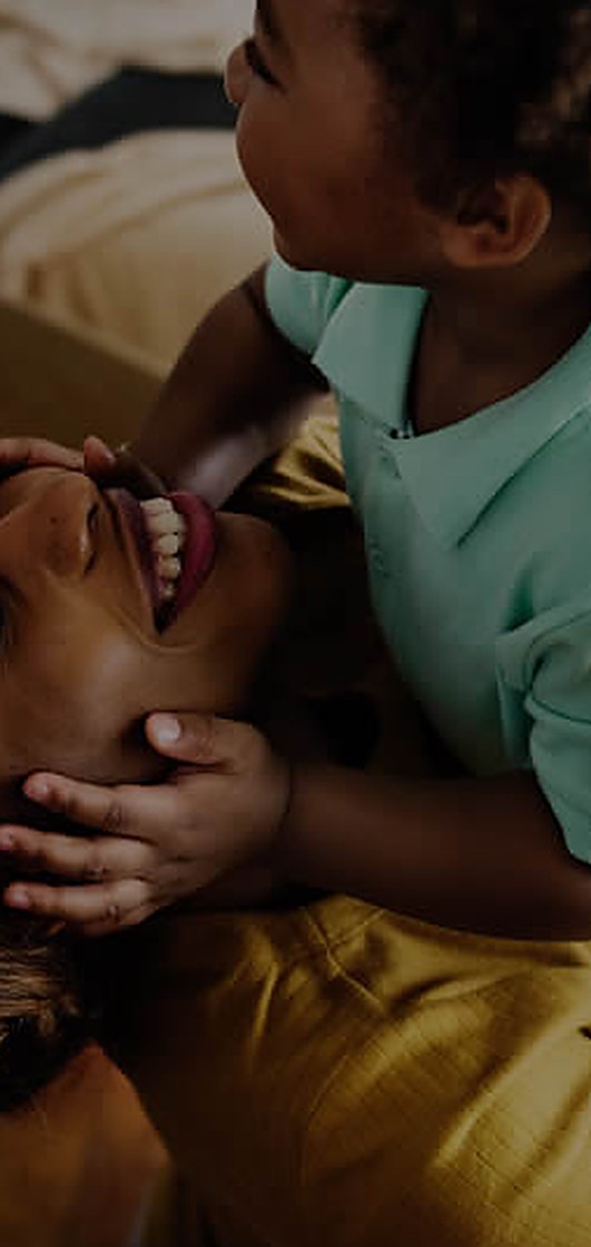 A parent and child sharing a moment at home